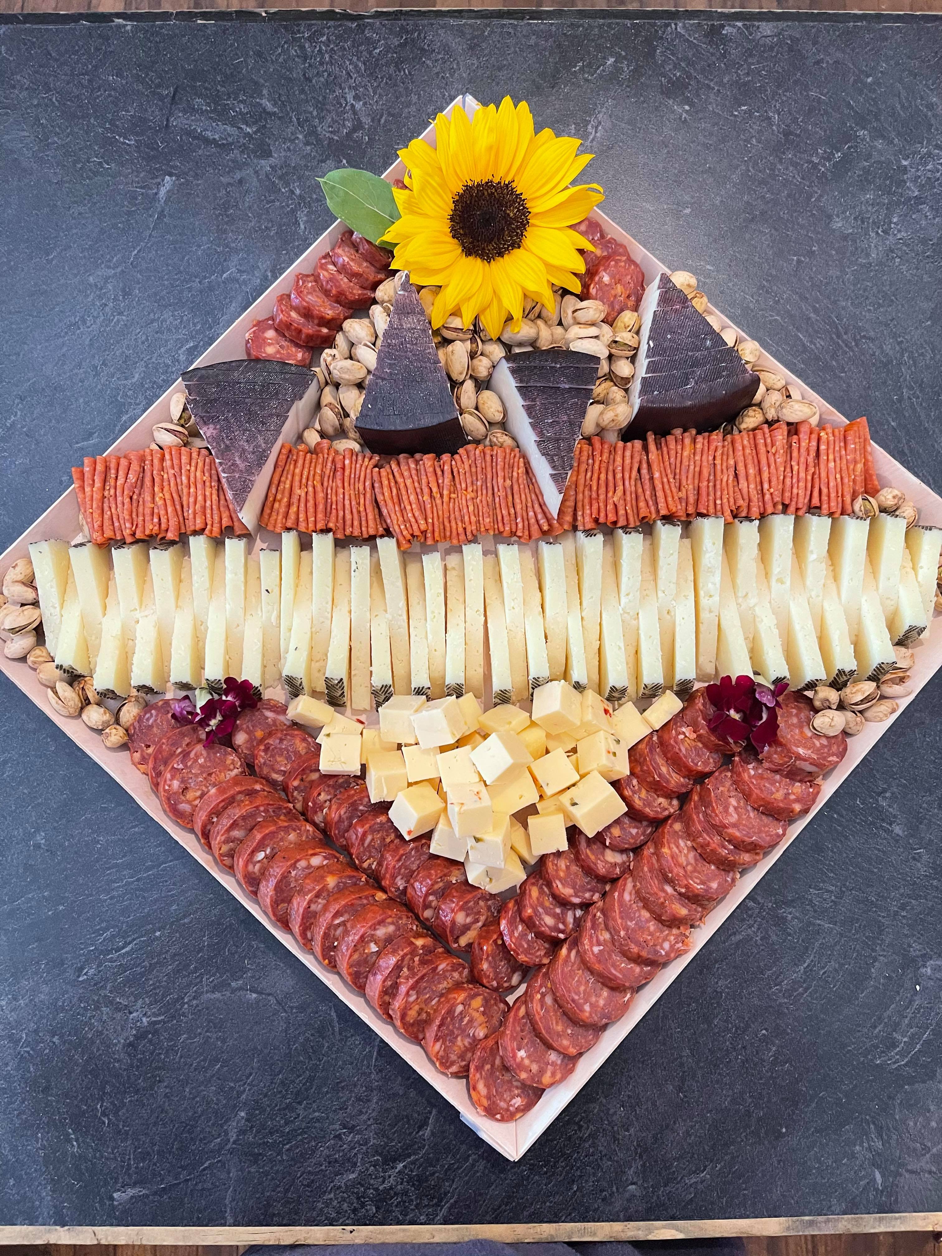 Pepperoni and cheese charcuterie tray with sunflower decorations